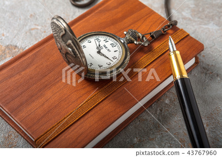 Diary with fountain pen and vintage pocket watch 43767960