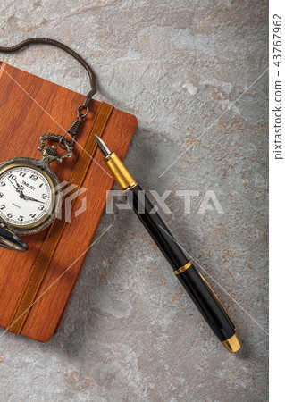 Diary with fountain pen and vintage pocket watch 43767962