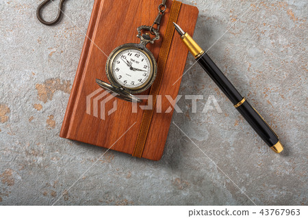 Diary with fountain pen and vintage pocket watch 43767963