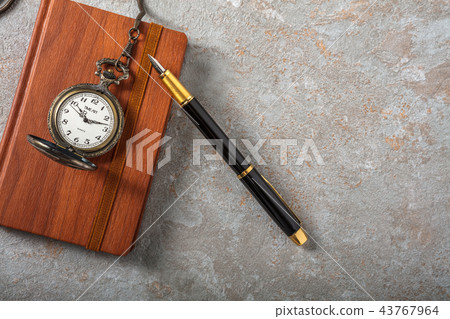 Diary with fountain pen and vintage pocket watch 43767964