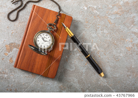 Diary with fountain pen and vintage pocket watch 43767966