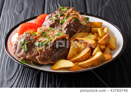 Beef steak Ossobuco with fried potatoes Beef steak Ossobuco with fried potatoes 43768740