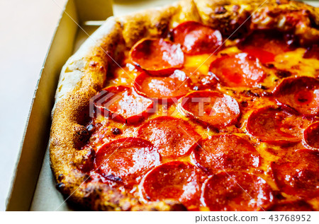 Delicious pizza in cardboard, pizza delivered 43768952