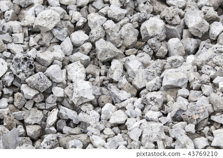 Crushed stone, pile of stones. Gray background 43769210