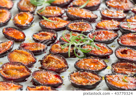 Spicy dried plums close-up. Spicy dried plums close-up. 43770324