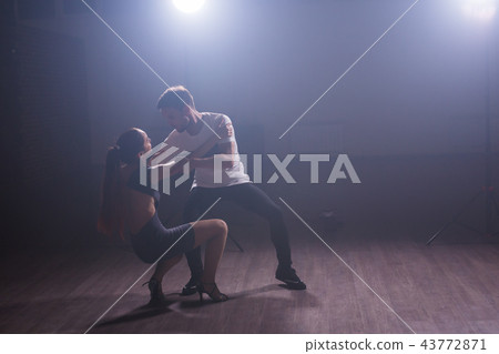 Active happy adults dancing bachata together in dance class Active happy adults dancing bachata together in dance class 43772871