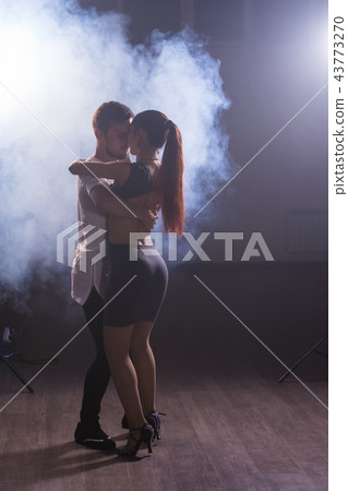 Young couple dancing latin dance Bachata, merengue, salsa. Two elegance pose in dance class 43773270