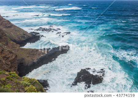 Seascape with rocky shore, atlantic ocean water on Tenerife, Spain Seascape with rocky shore, atlantic ocean water on Tenerife, Spain 43774159