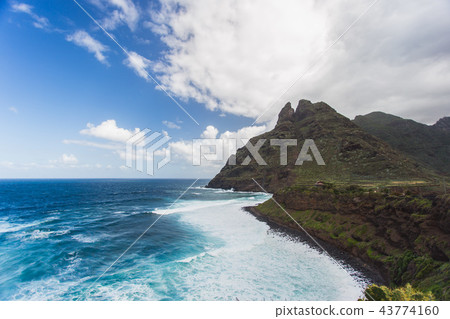 Beautiful Atlantic ocean coast with rocks and stones - Tenerife, Canary islands, Spain Beautiful Atlantic ocean coast with rocks and stones - Tenerife, Canary islands, Spain 43774160