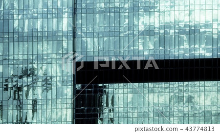 Sky and clouds reflecting in a modern skyscraper in business district Sky and clouds reflecting in a modern skyscraper in business district 43774813
