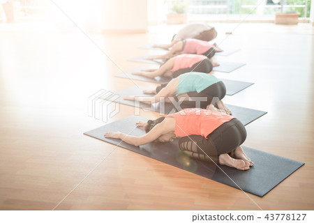 Asian woman doing yoga in yoga studio 43778127