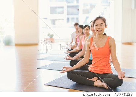 Asian woman doing yoga in yoga studio 43778128