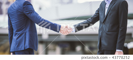 handshake of business People shaking hand in city handshake of business People shaking hand in city 43778252