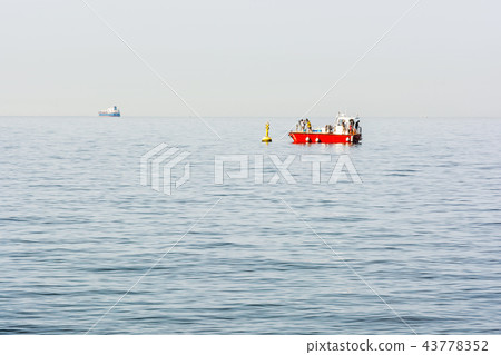People on the red boat, Gulf of Trieste, Italy People on the red boat, Gulf of Trieste, Italy 43778352