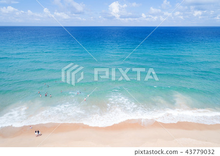 People enjoy swimming in tropical sea People enjoy swimming in tropical sea 43779032