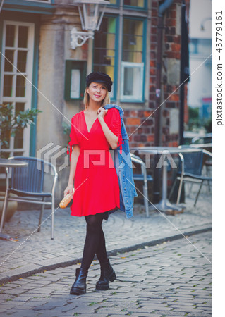 Young lady in dress on medieval street of Bremen 43779161