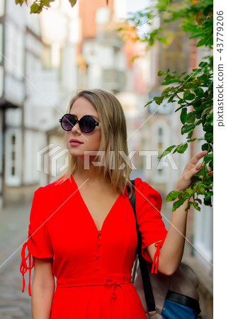 Young lady in dress on medieval street of Bremen 43779206