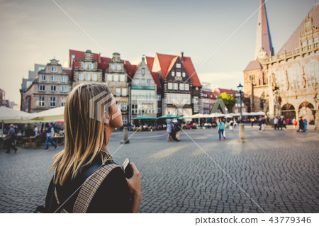 Young lady in dress on medieval street of Bremen 43779346