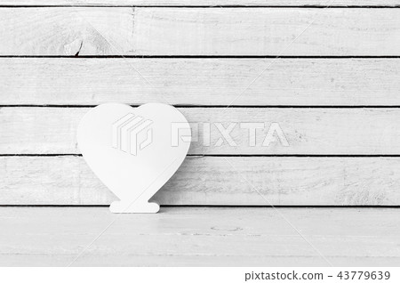 White Heart Shaped over white wood background 43779639