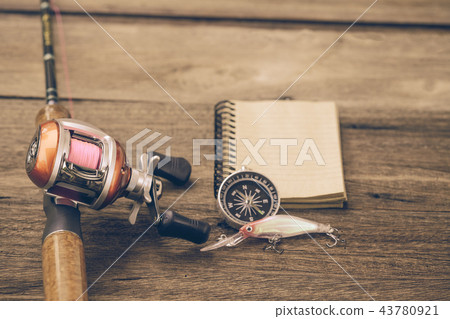 Fishing tackle Baitcasting Reel, book and compass Fishing tackle Baitcasting Reel, book and compass 43780921