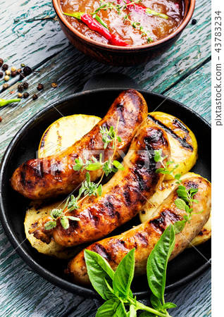 Grilled sausages in frying pan 43783234
