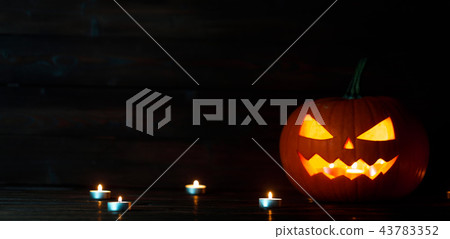 Halloween pumpkin and candles Halloween pumpkin and candles 43783352