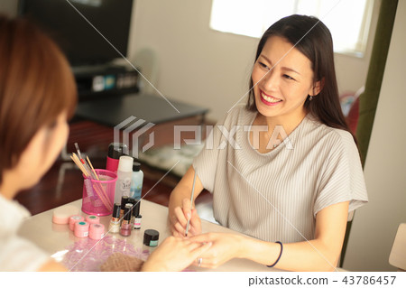 A woman who is nailing 43786457