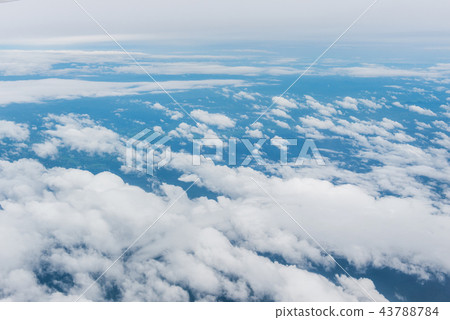 clouds and blue sky through airplane window clouds and blue sky through airplane window 43788784