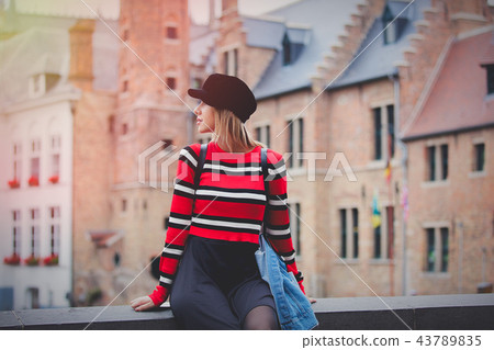 Young girl red sweater, in hat at streets of Bruges, Young girl red sweater, in hat at streets of Bruges, 43789835