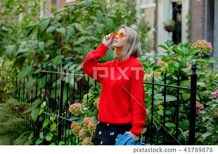 girl in red sweater in Amsterdam girl in red sweater in Amsterdam 43789878