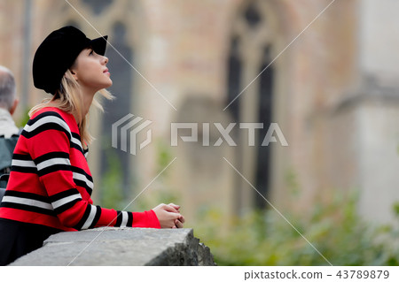 Young girl red sweater, in hat at streets of Bruges, Young girl red sweater, in hat at streets of Bruges, 43789879