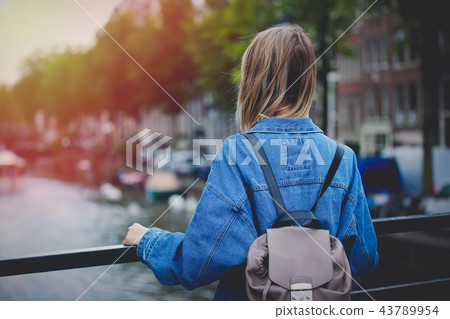girl with backpack in Amsterdam  43789954