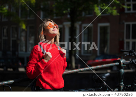 Style girl in sunglasses in Amsterdam Style girl in sunglasses in Amsterdam 43790286
