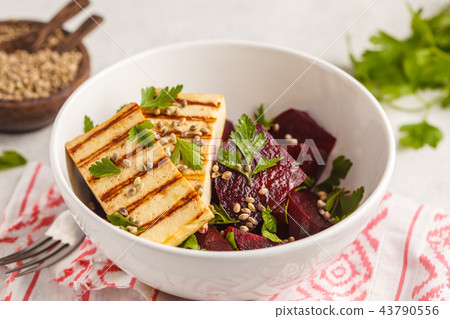 Baked beet salad with grilled tofu parsley and oil Baked beet salad with grilled tofu parsley and oil 43790556