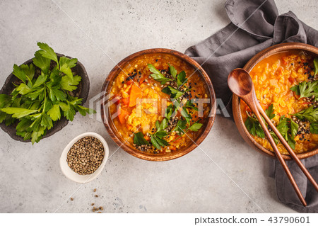 Yellow Indian vegan lentil soup curry with parsley 43790601