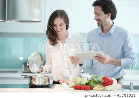 Couple cooking dinner Couple cooking dinner 43791021