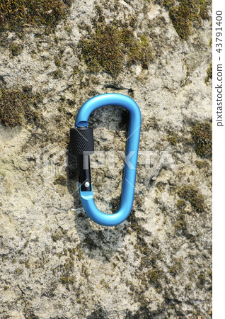 Carabiner  on rocky background. 43791400