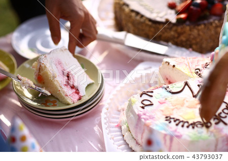 kids birthday cake cut on plate kids birthday cake cut on plate 43793037