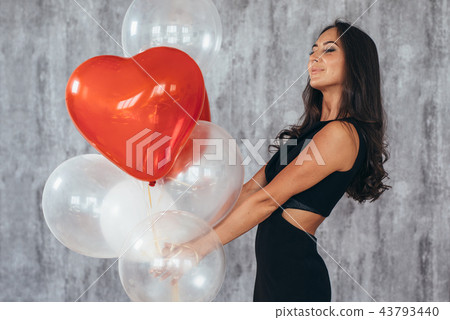 Beauty girl with air balloons smiling Celebrating Holiday Beauty girl with air balloons smiling Celebrating Holiday 43793440