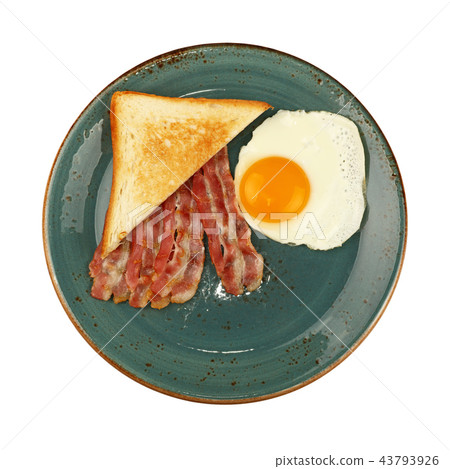 Close up egg, toast and bacon on blue plate Close up egg, toast and bacon on blue plate 43793926