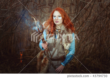 Pagan woman is a sorcerer. 43794730