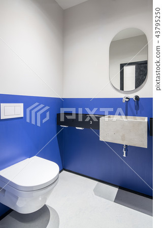 Restroom with multicolor walls and concrete sink 43795250