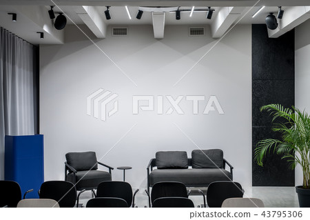 Stylish interior in loft style with gray walls 43795306