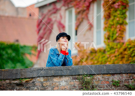 Young girl in hat at bridge in Bruges 43796540