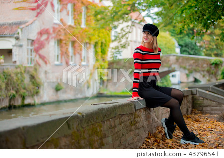 Young girl in hat at bridge in Bruges 43796541