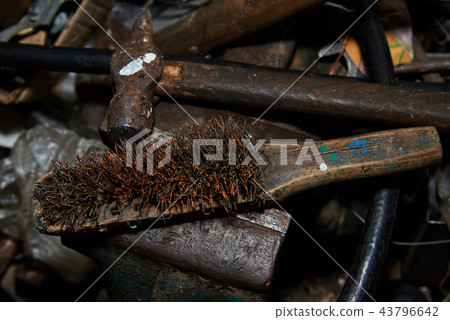 Rusty Metal brush and hammer on the gripe 43796642