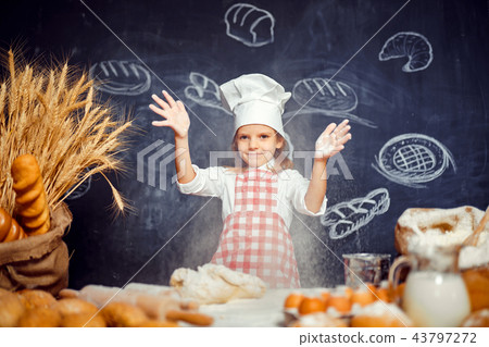 Playful little girl throwing flour powder 43797272