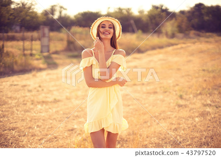 beautiful young woman outdoor on the hill on a summer day beautiful young woman outdoor on the hill on a summer day 43797520