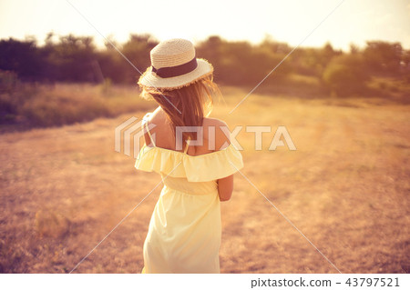 beautiful young woman outdoor on the hill on a summer day beautiful young woman outdoor on the hill on a summer day 43797521