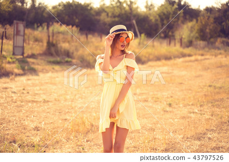 beautiful young woman outdoor on the hill on a summer day 43797526